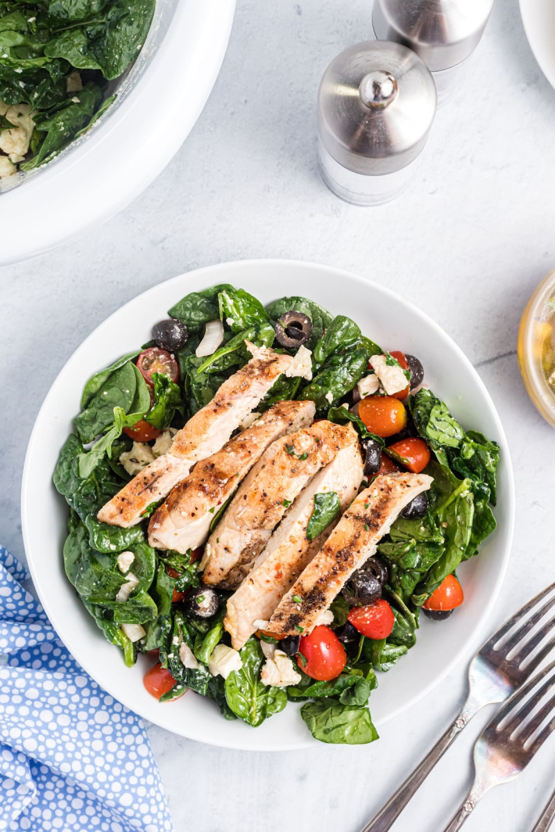 plate of spinach salad with chicken