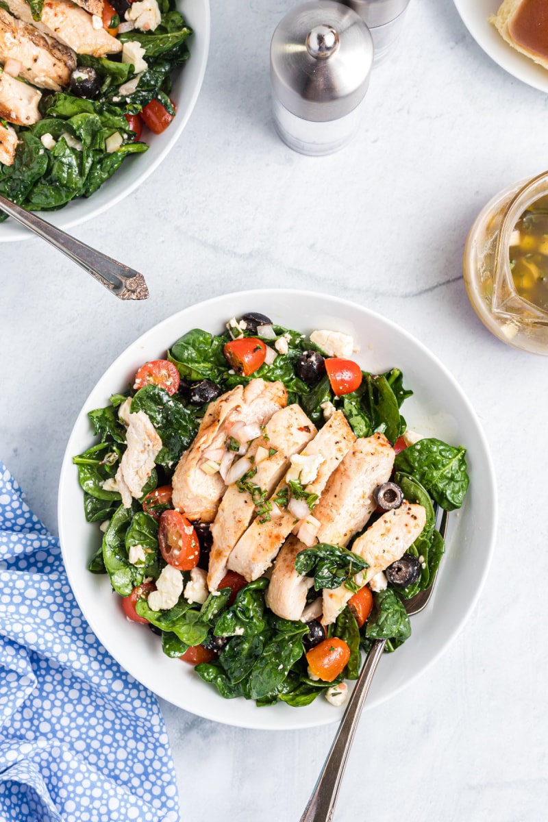 plate of spinach salad with chicken