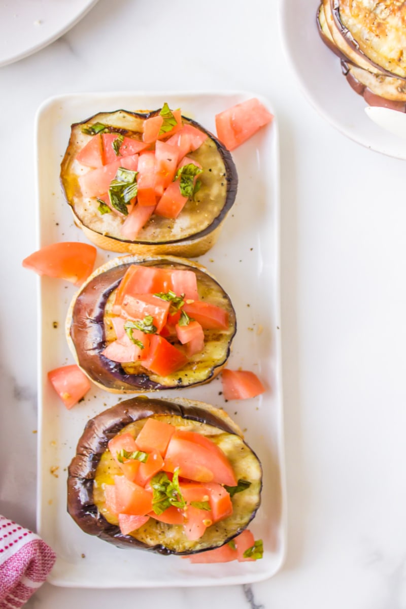 three grilled eggplant open faced sandwiches