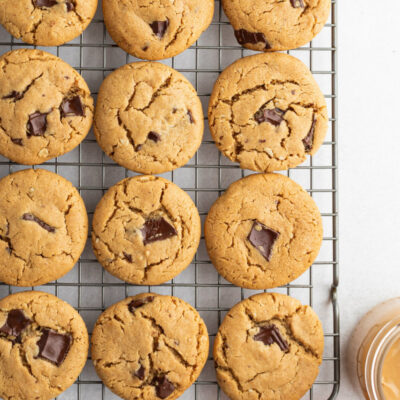 honey peanut butter chocolate chunk cookies on a cooling rack