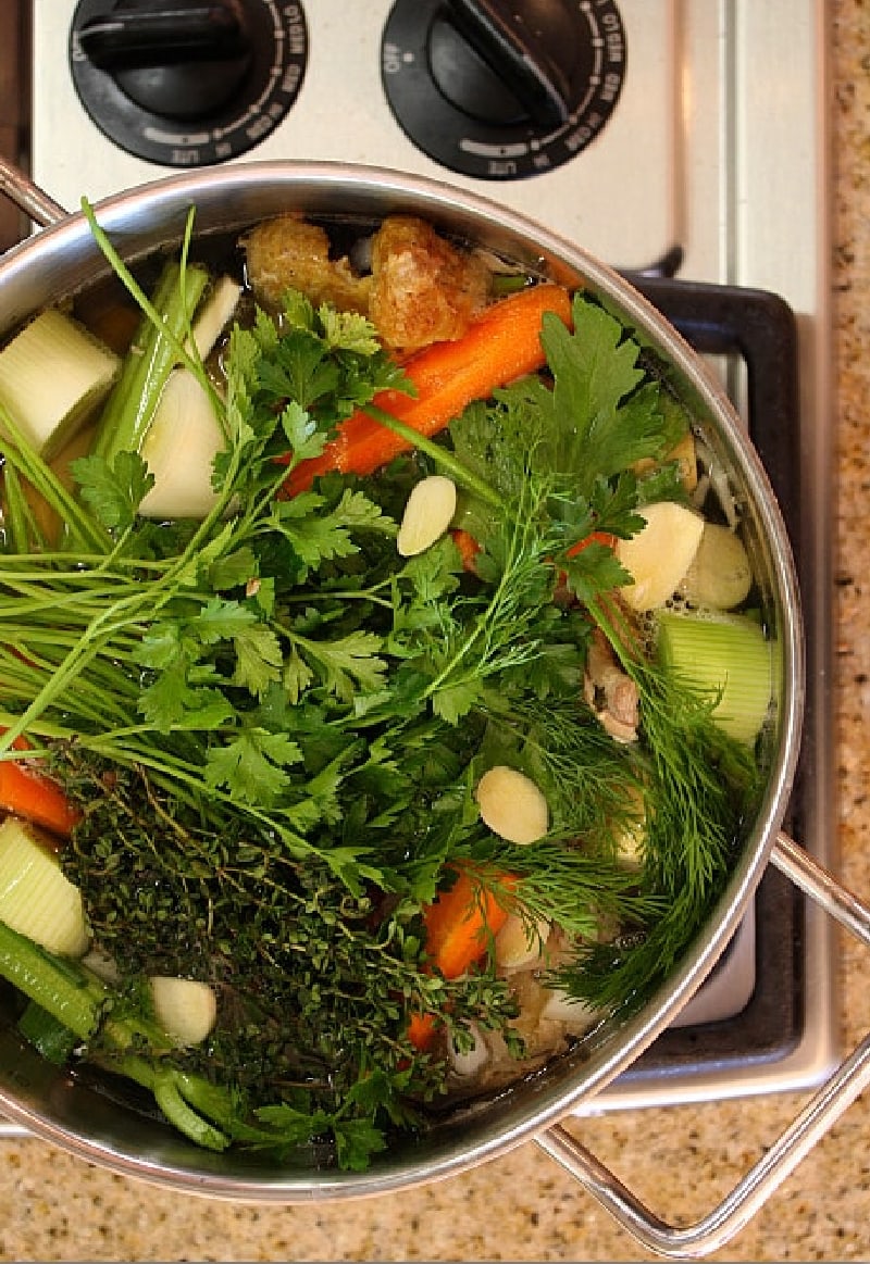 pot of veggies simmering to make broth