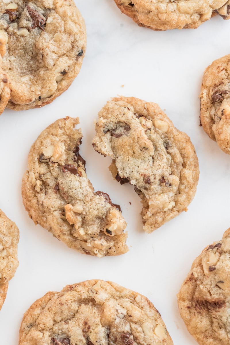 Ina Garten's Chocolate Chunk Cookies recipe from RecipeGirl.com #ina #garten #inagarten #barefoot #contessa #barefootcontessa #chocolatechunk #cookie #cookies #recipe #RecipeGirl chocolate chunk cookie pulled apart to show the inside