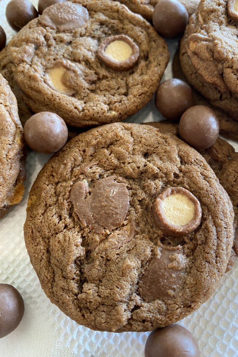 malted milk cookies with malt balls scattered around