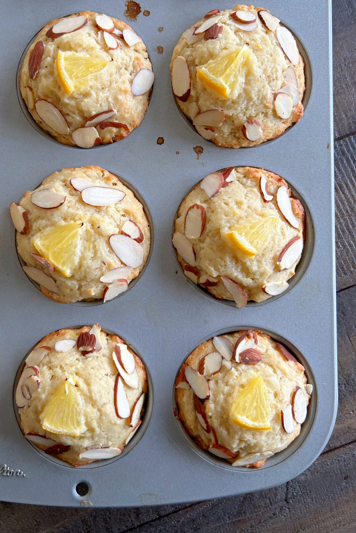 meyer lemon ricotta muffins in muffin pan