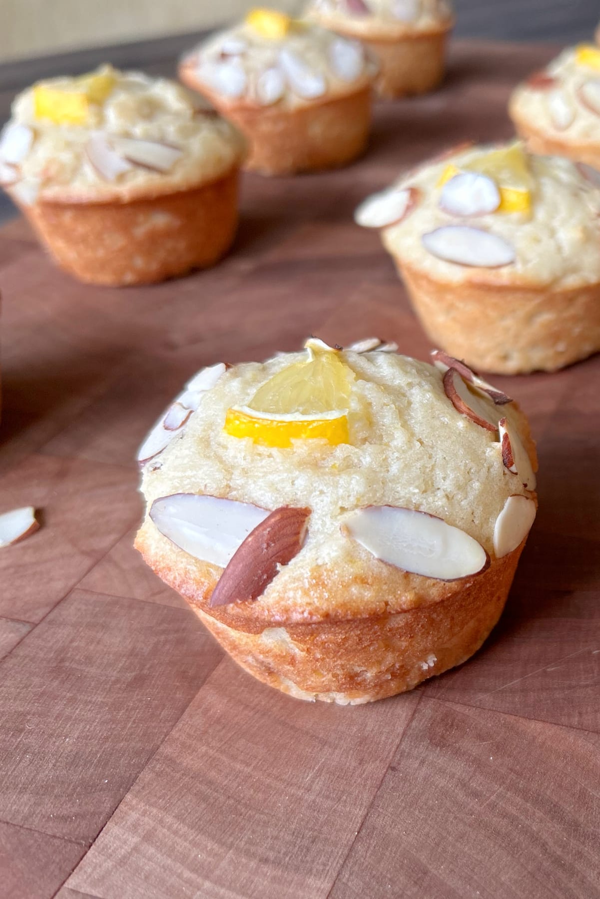 meyer lemon ricotta muffins on board