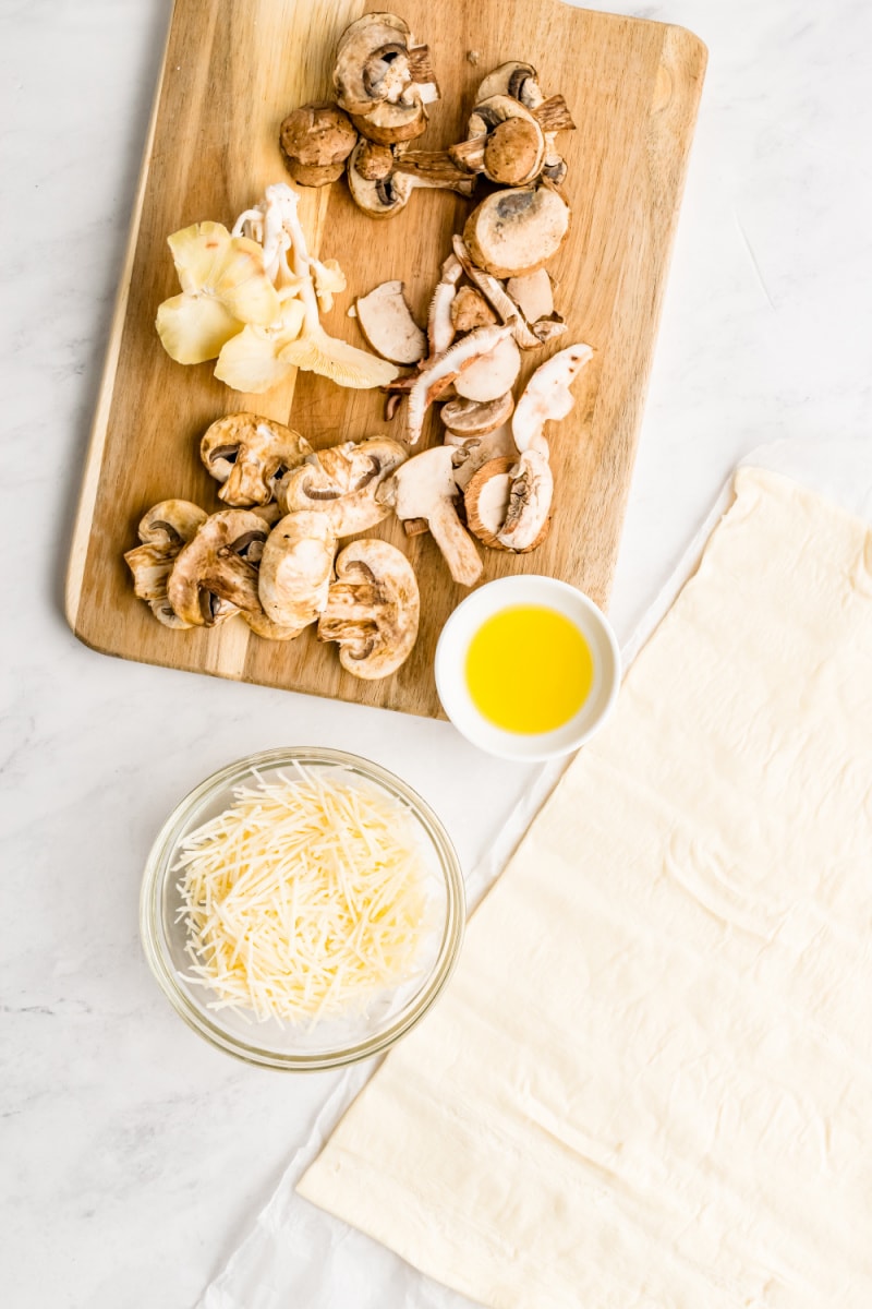 ingredients displayed for making mushroom and cheese tarts