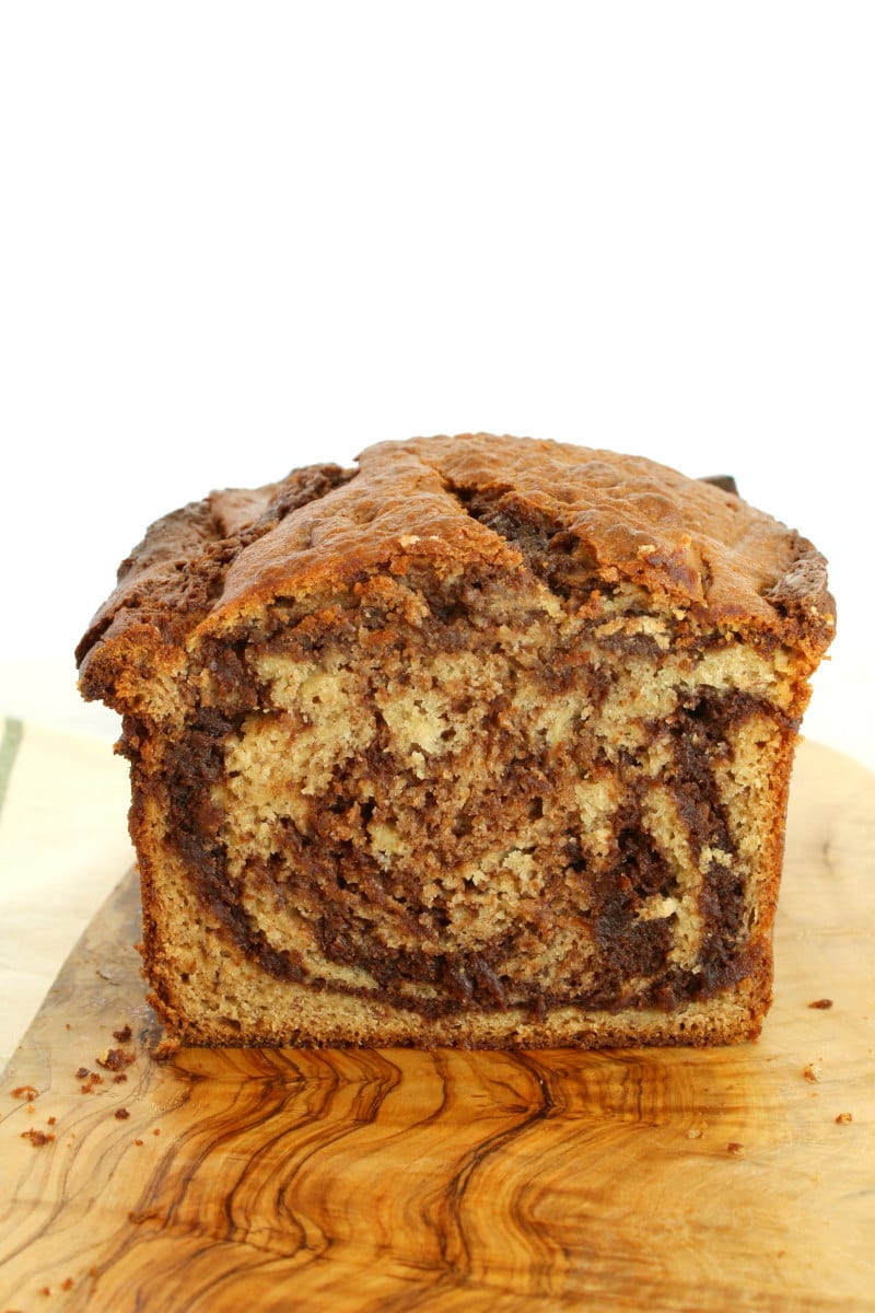 looking at a sliced open loaf of nutella swirled banana bread