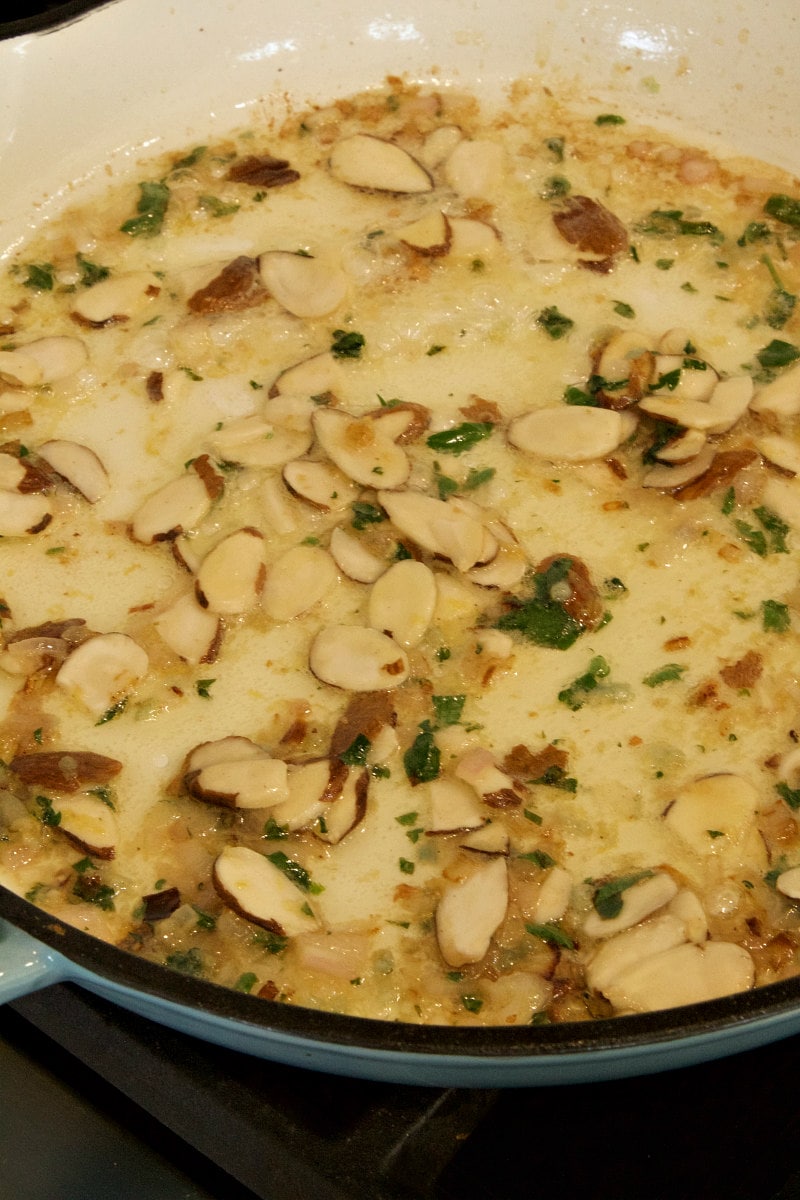 almonds and butter being cooked in a skillet