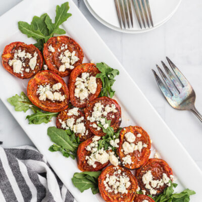 roasted tomatoes with stilton displayed on a platter