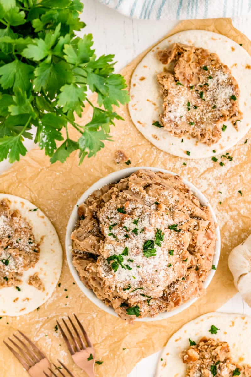 rubios pinto beans in a bowl and on tortillas