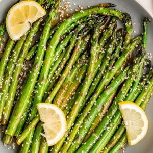 pinterest image for sesame asparagus
