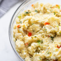 smashed potato salad in a glass bowl