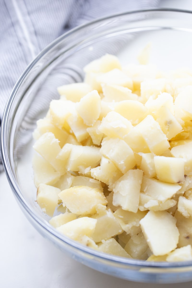 cooked, cubed potatoes in a glass bowl