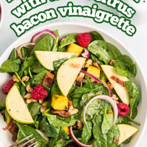 pinterest image for spinach salad with warm citrus bacon vinaigrette