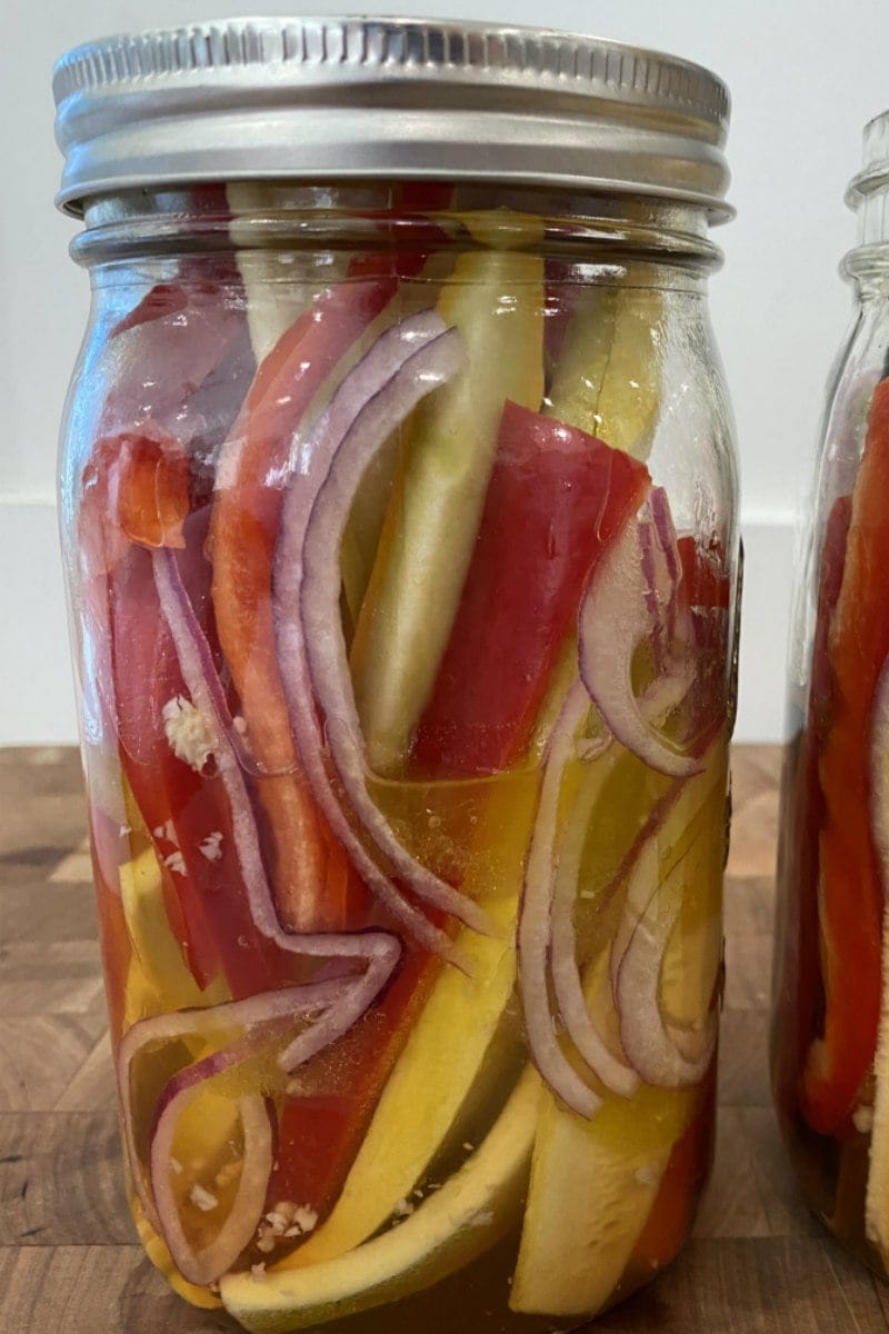 sweet and sour summer vegetables marinating in a jar