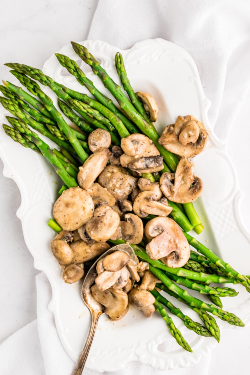 asparagus with garlic mustard sauce on platter