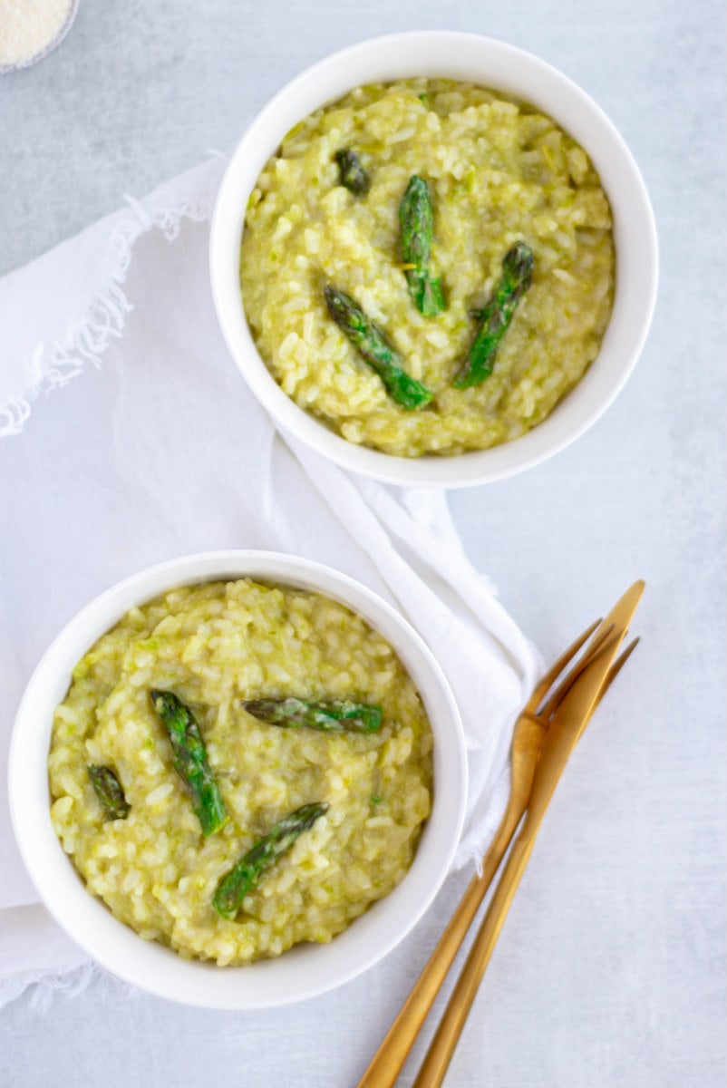 asparagus risotto win two white bowls