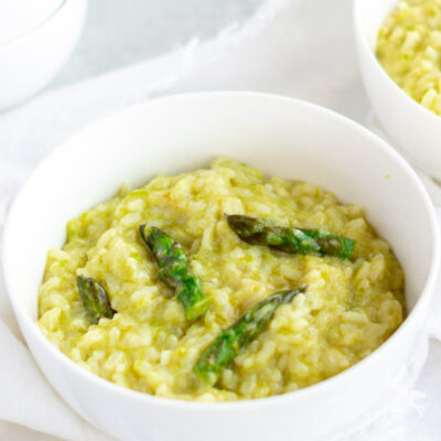 asparagus risotto in white bowl