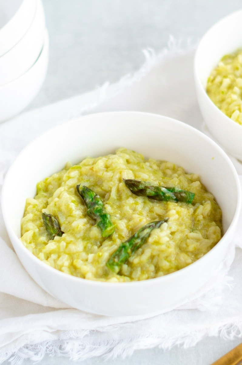 asparagus risotto in white bowl