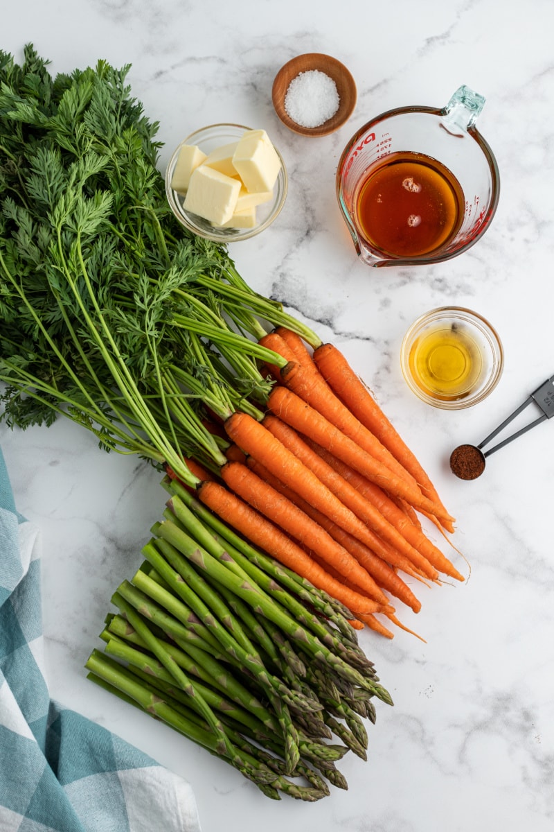 ingredients displayed for carrots and asparagus