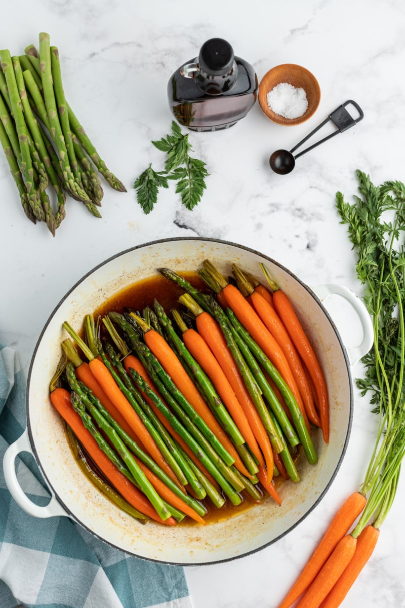 carrots and asparagus cooking in maple butter sauce