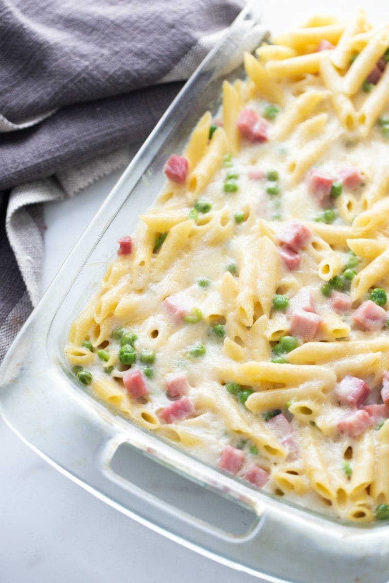 cheesy baked penne in glass dish just out of oven