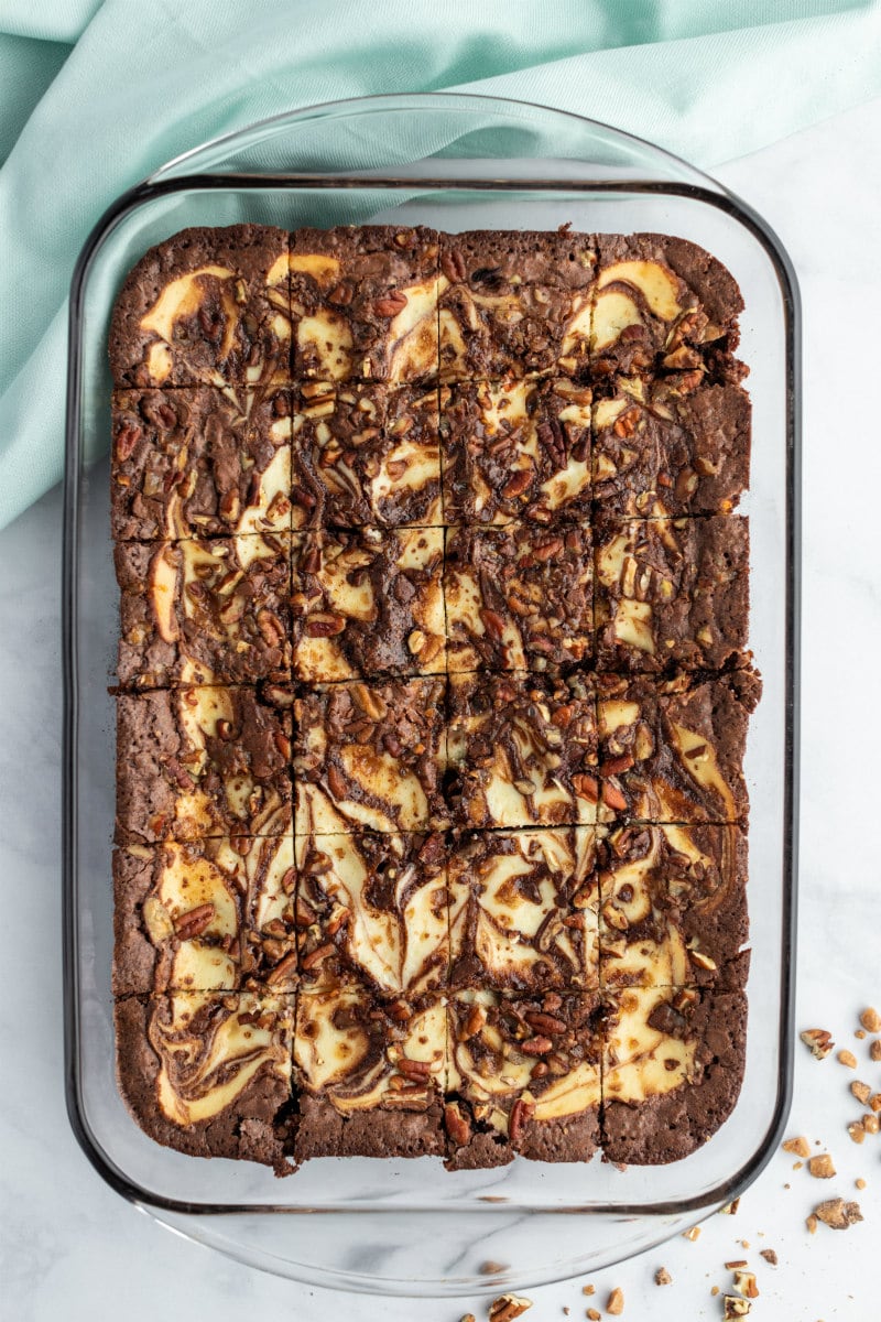 overhead shot of brownies in a pyrex pan cut into pieces