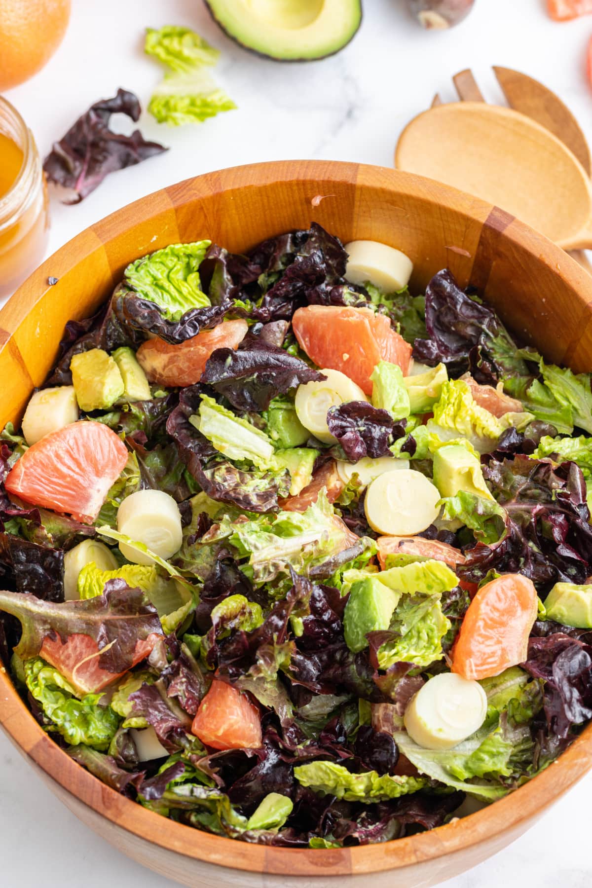 wooden bowl of hearts of palm avocado salad