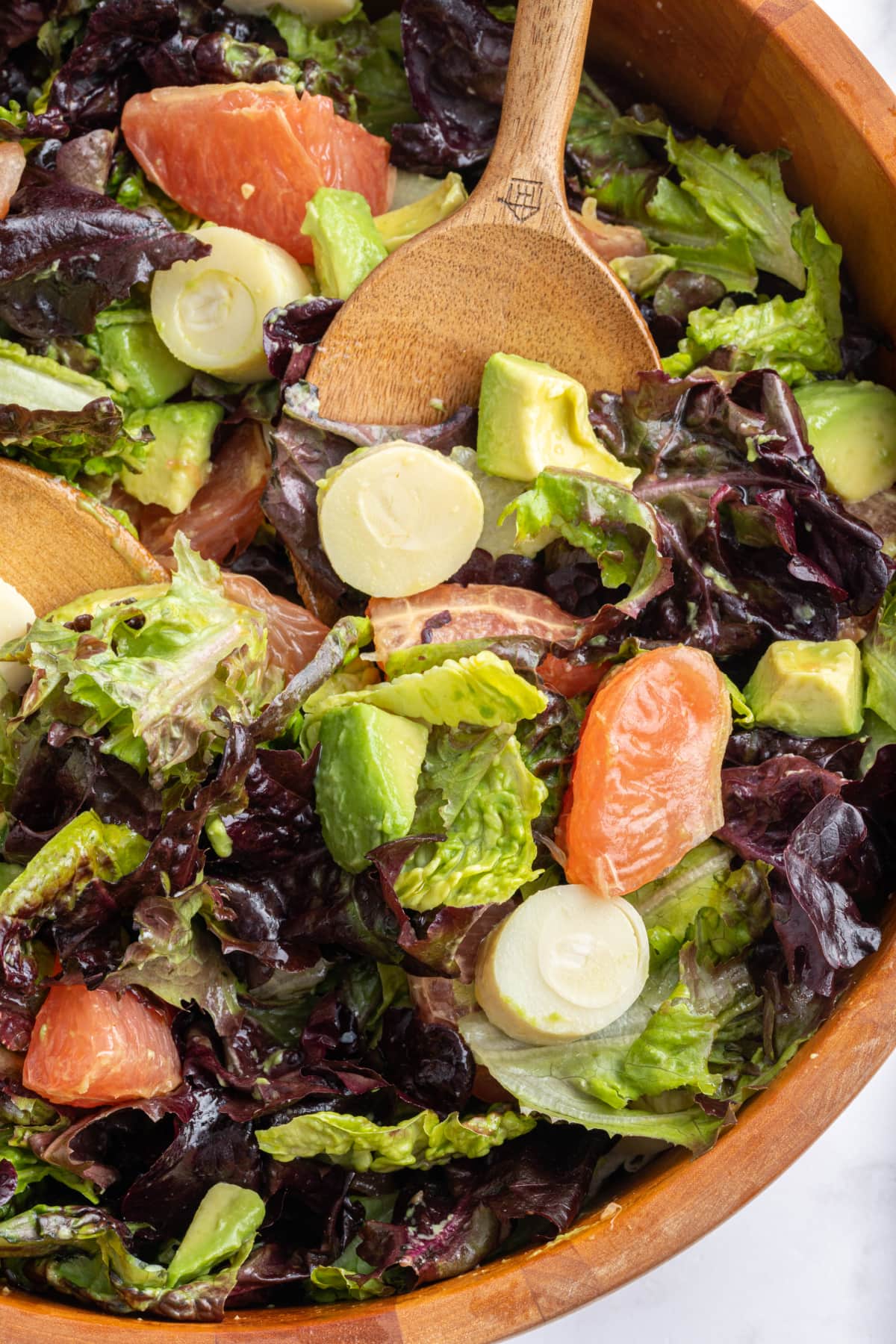 bowl of salad with serving spoon