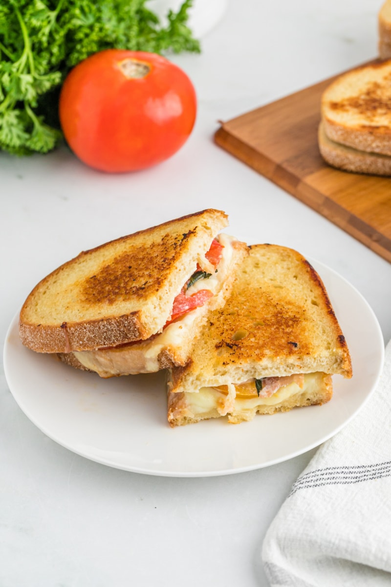 two halves of Italian grilled cheese on plate