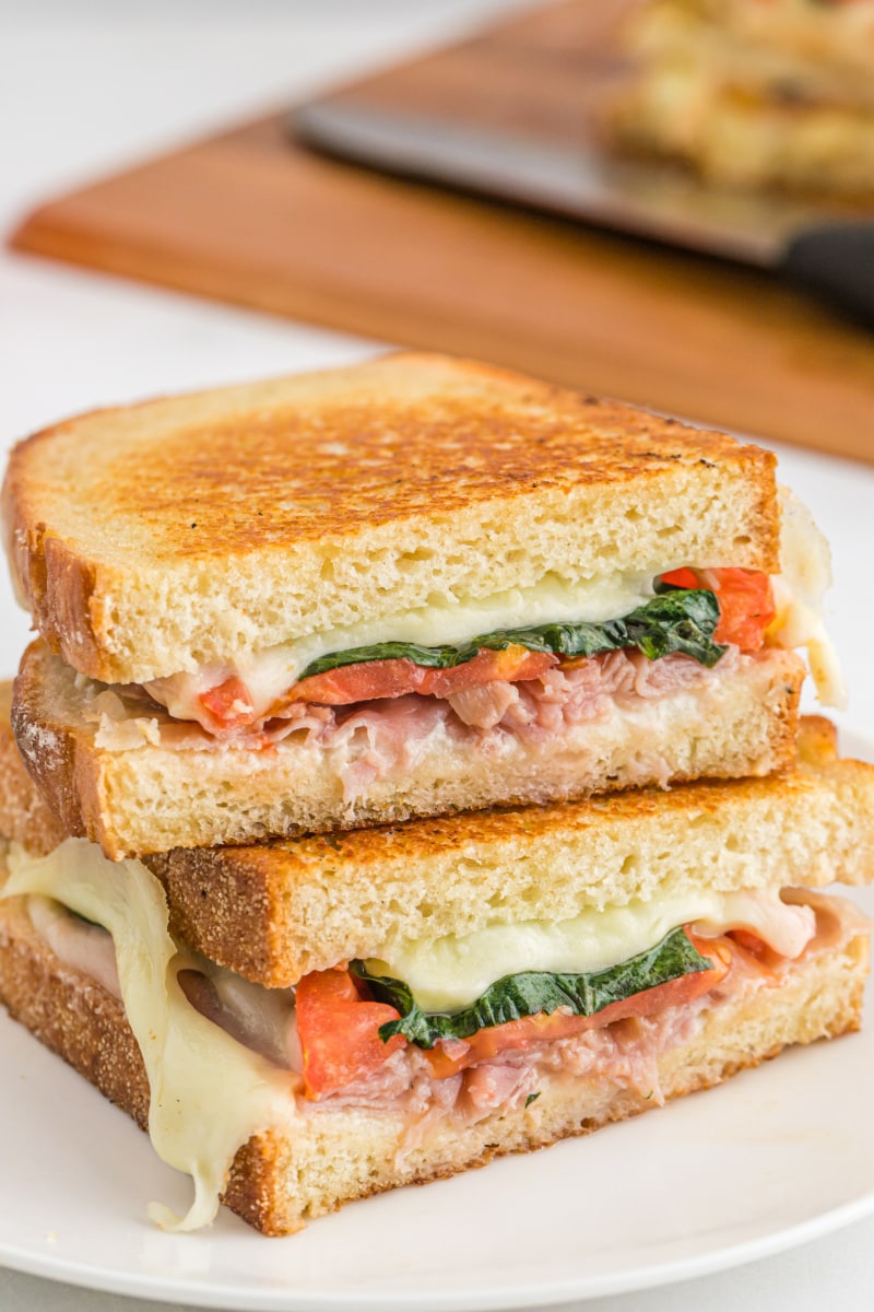 two halves of italian grilled cheese stacked