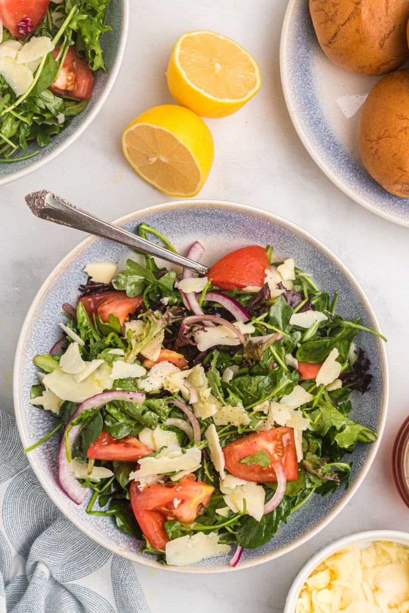 mixed green salad with honey lemon dressing in bowl