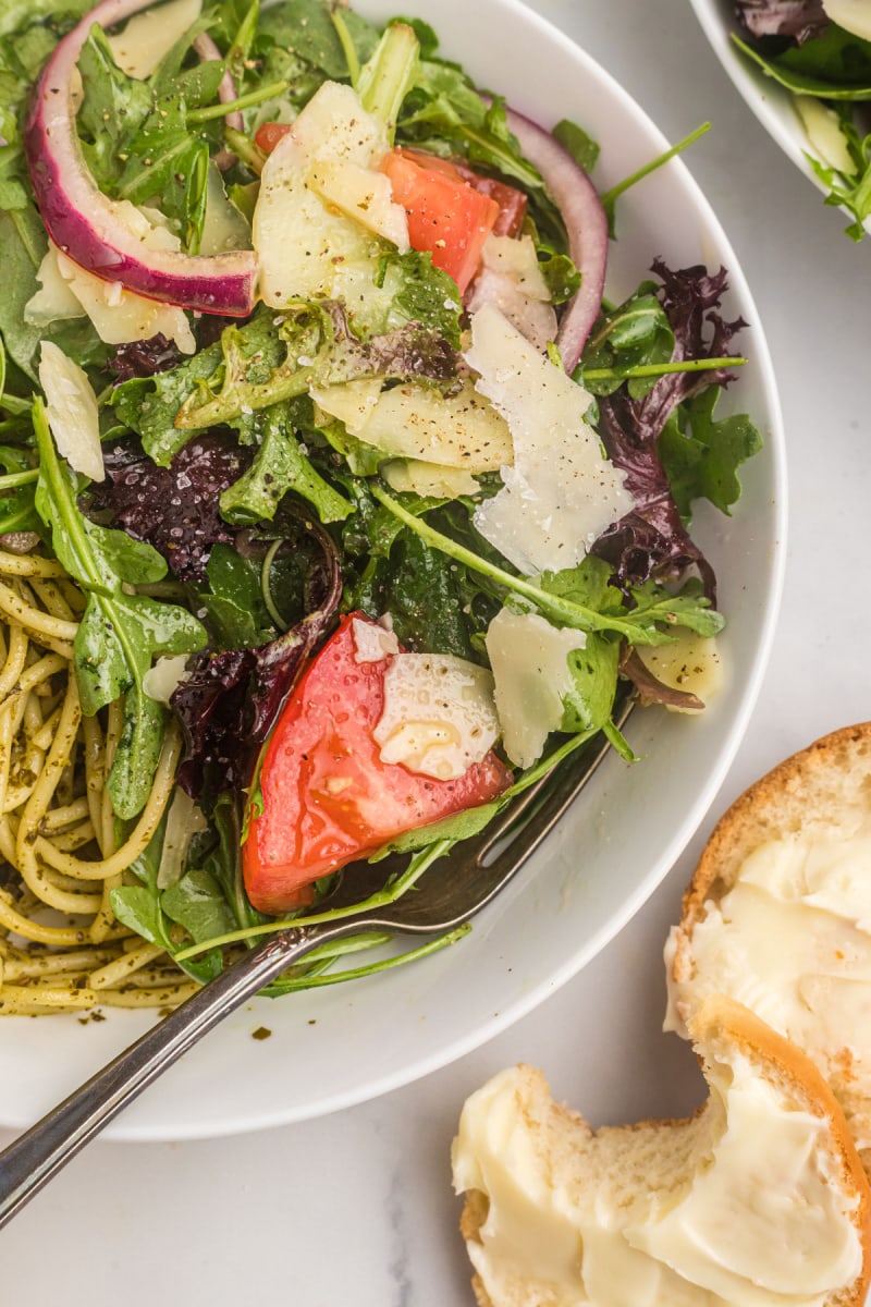 close up green salad with pasta in bowl