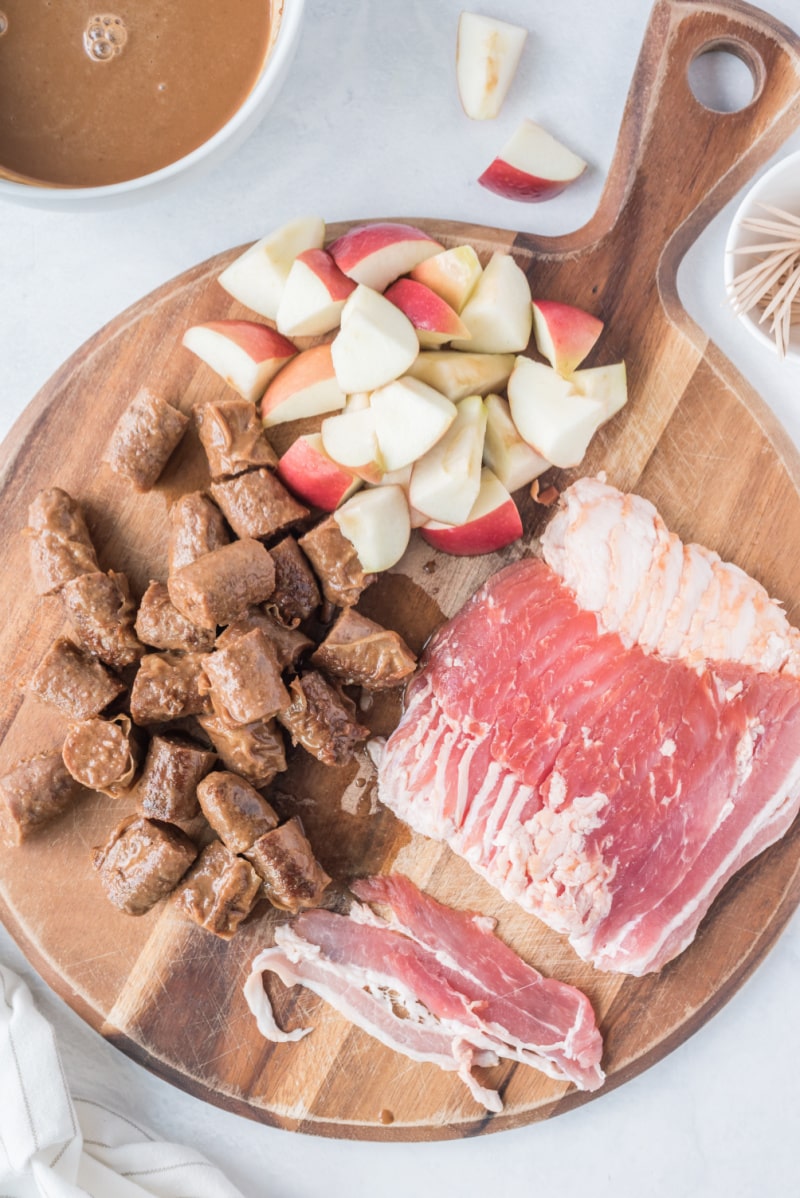 ingredients displayed for making bacon wrapped apple and sausage