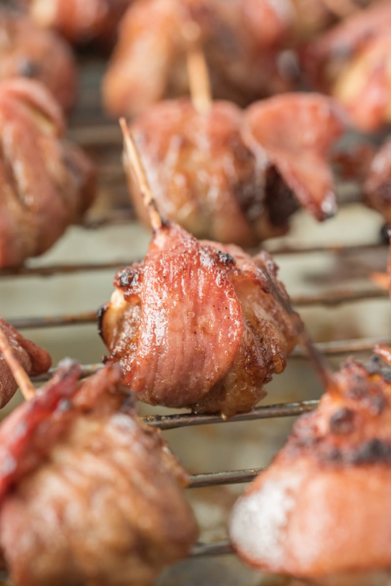 bacon wrapped appetizers on a baking pan