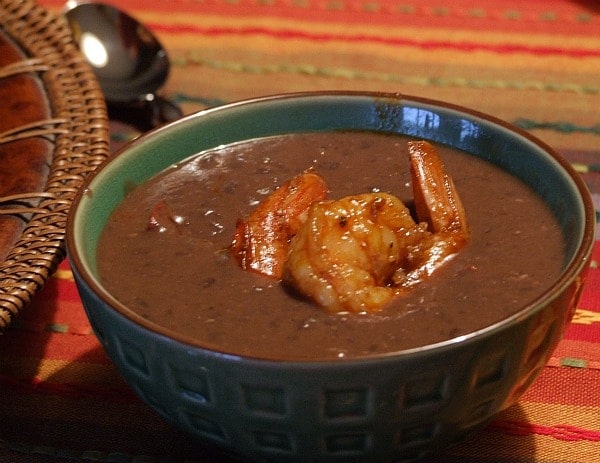 bowl of Black Bean Bisque topped with shrimp