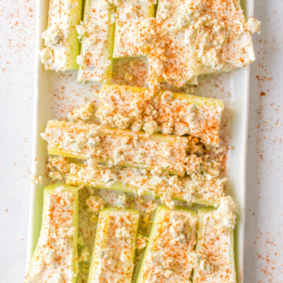 buffalo celery sticks on a white platter