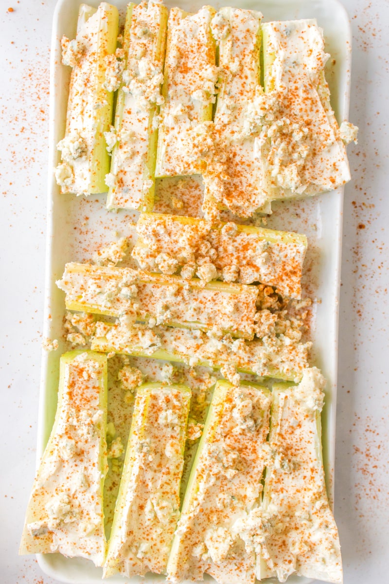 buffalo celery sticks on a white platter