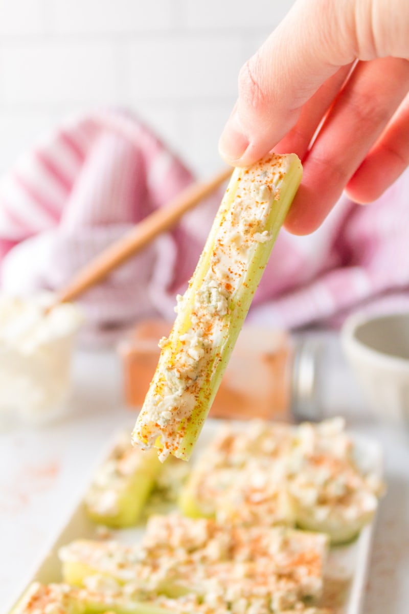 hand picking up buffalo celery stick