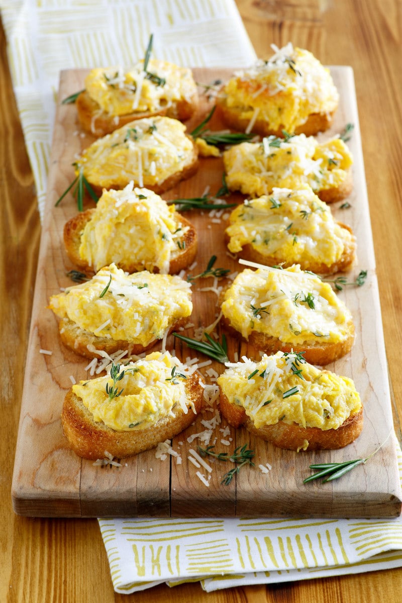 Butternut Squash Spread on Baguette Slices, displayed on a board for a party