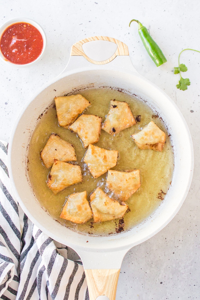 won tons frying in a pan