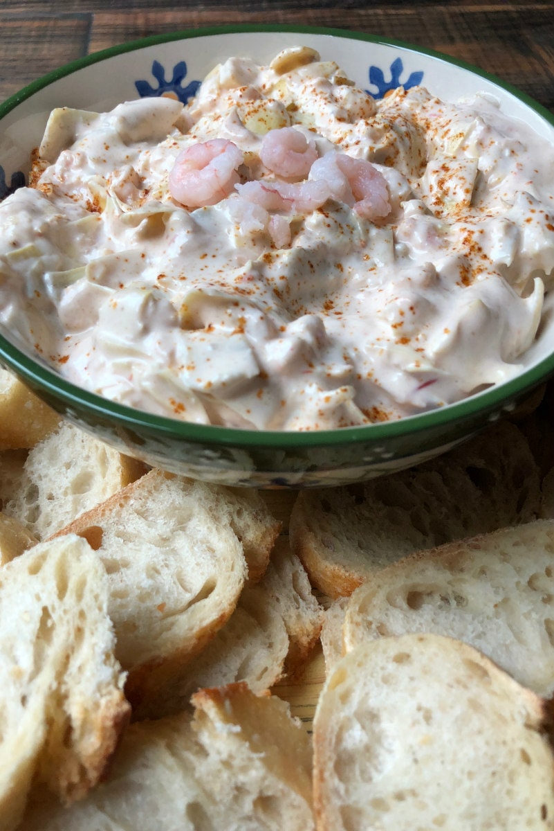 bowl of Chili Shrimp Dip served with sliced baguette