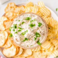 clam dip in bowl with potato chips