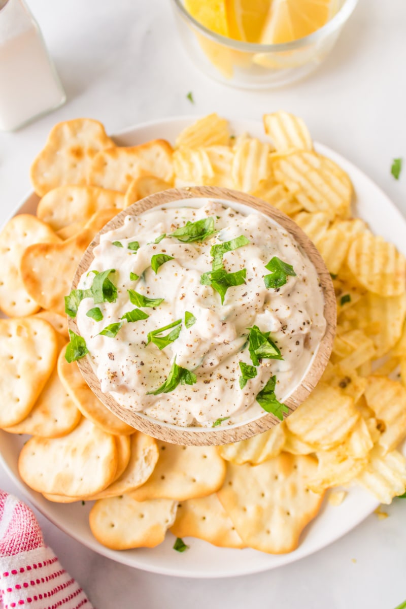 clam dip in bowl with potato chips