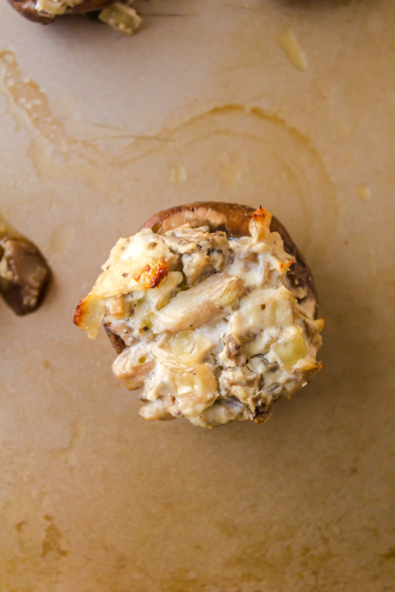 goat cheese stuffed mushroom on baking sheet