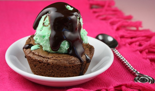brownie in a dish with mint ice cream and hot fudge