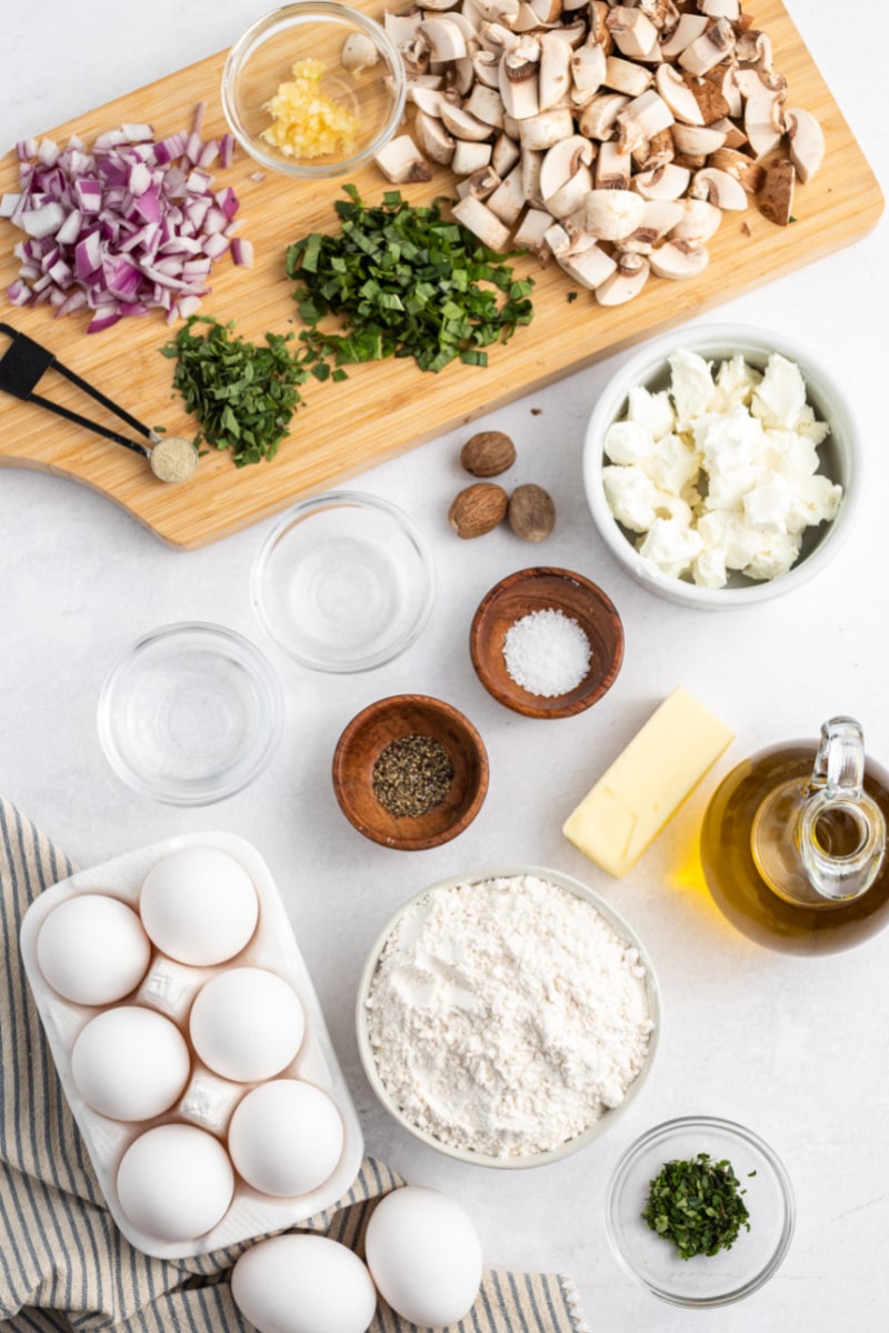 ingredients displayed for making mushroom and goat cheese quiche