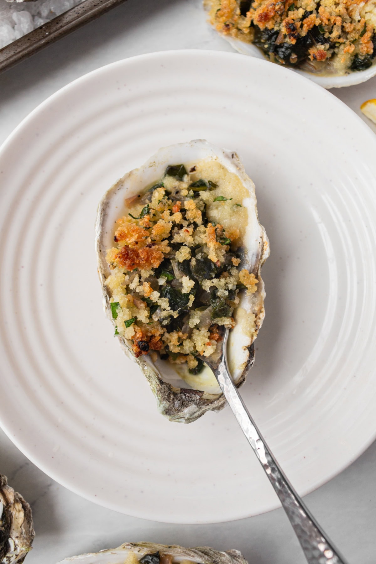 How to Make Oysters Rockefeller : an easy appetizer for a dinner party or happy hour : recipe from RecipeGirl.com oysters rockefeller serving on plate