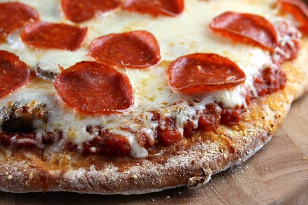 Peek at the edge of a pepperoni pizza