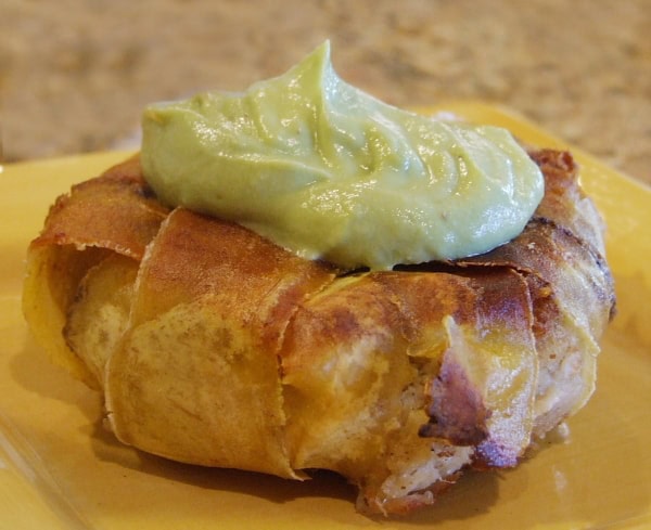 Plantain Wrapped Crab Cakes Plantain Wrapped Crab Cake topped with Avocado Aioli